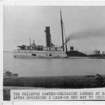 Philefus Sawyer unloading lumber