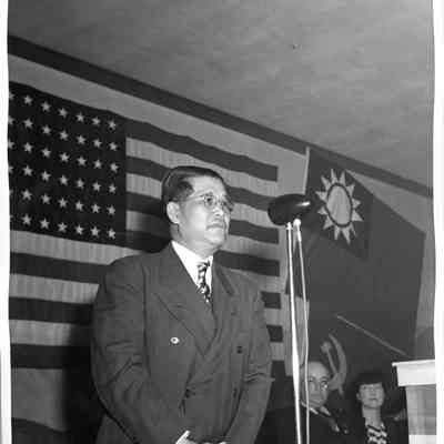 Unidentified man behind microphone