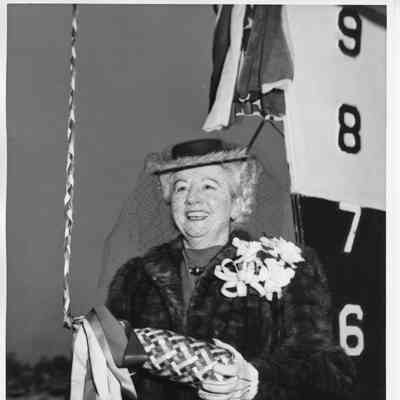 Woman holding christening bottle at christening of PC-1229