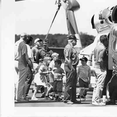 Eleven people outside of a rescue helicopter