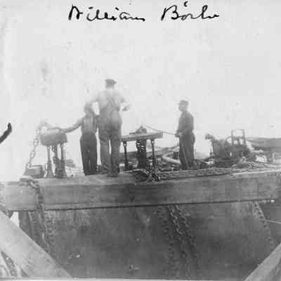 Three men on vessel