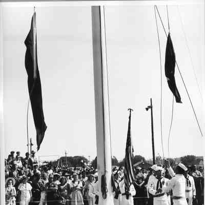 US Coast Guard color guard raising maritime M pennant flag