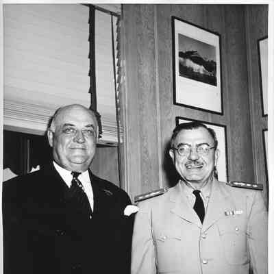 Two unidentified military men standing in L.D. Smith's office