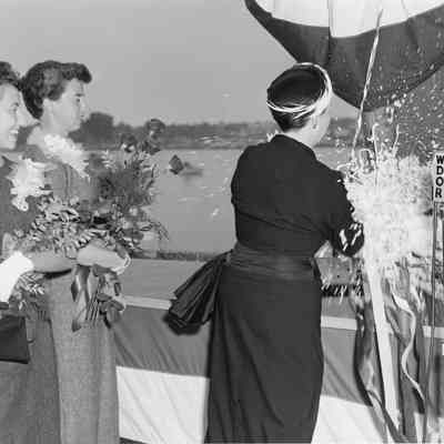 Woman christening boat