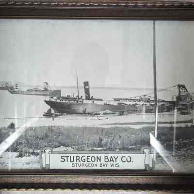 Framed photograph of three ships in water at Sturgeon Bay Co.