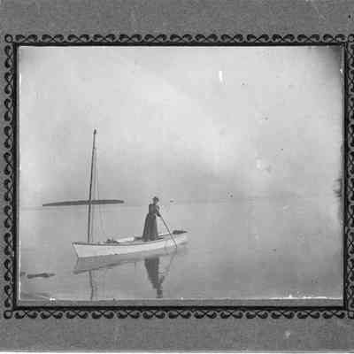 Daughter of Joseph Harris pushing boat with pole