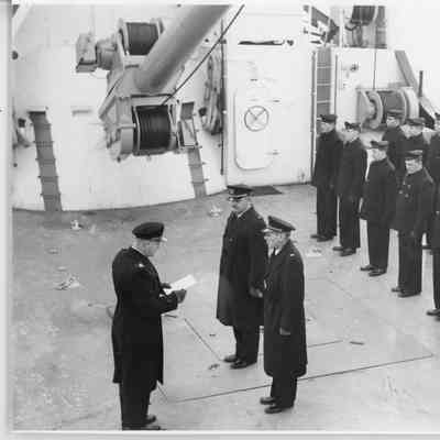 sailors listening to speech on deck