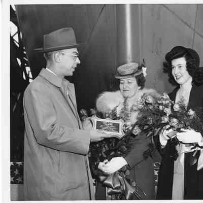 Mrs. Paul H. townsend receiving plaque for cargo vessel AK-217 Tulare