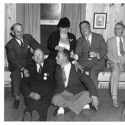Group of men and women sitting