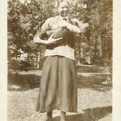 Woman holding dachshund