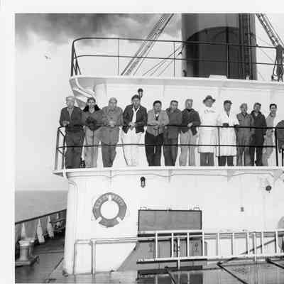 C. Ray Christianson and group on deck of Elton Hoyt II