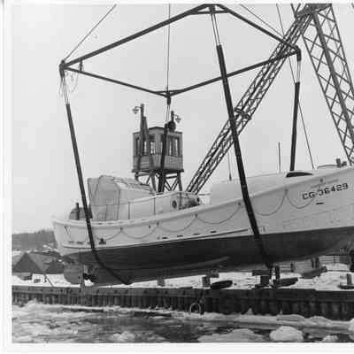 CG-36429 suspended above icy water