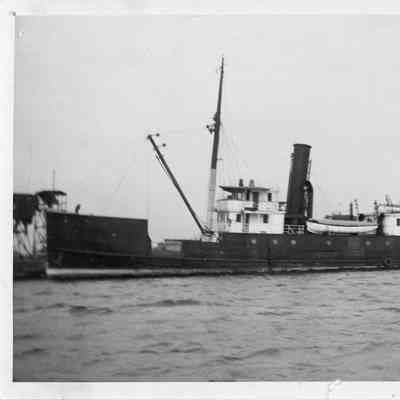 Steamboat with two small boats on deck