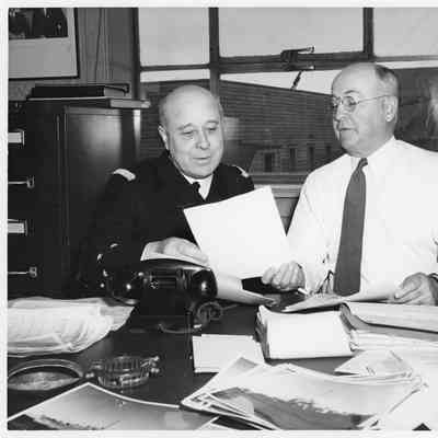 L.D. Smith and man sitting at table in office