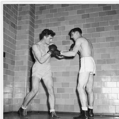 Two men boxing with shirts off