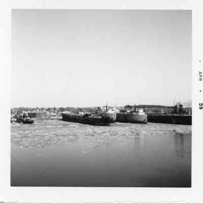 Docked vessels in winter with one belonging to L. Wyandotte Chemicals April 1959