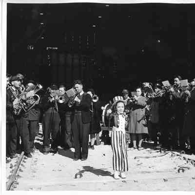 Child in USA themed suit at christening of PF-64 Uss Knoxville