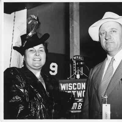 C. Ray Christianson and woman in dress at PC-1225 ship christening