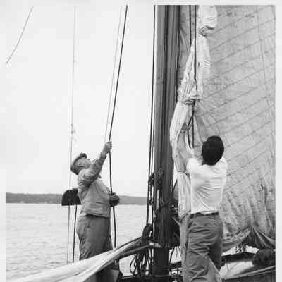 L.D. Smith and R.A. Stearn hoisting sail on the Half Moon