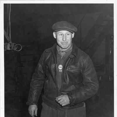 W.N. Olson LD Smith employee 1286 leadman wearing badge