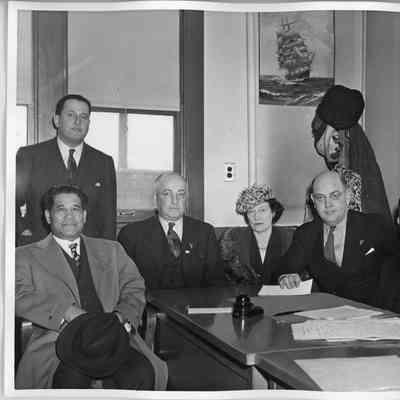 Captain Polking Horne, L.D. Smith, Mrs. Gallieane, Rob Carruthers at table