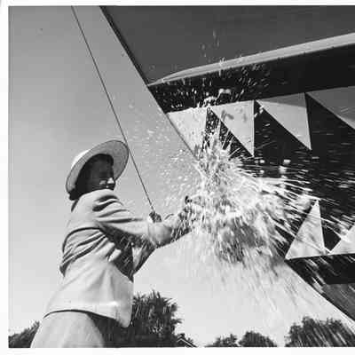 Ship sponsor christening P-571 at Peterson Boat Works July 15, 1944