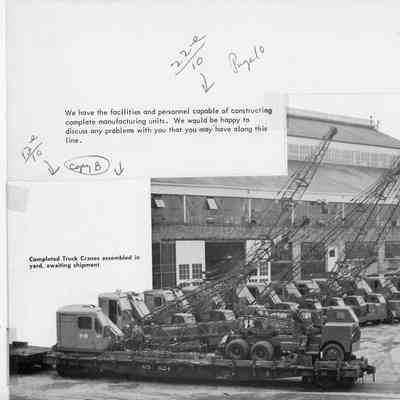 Completed truck cranes assembled at Christy Corp in yard