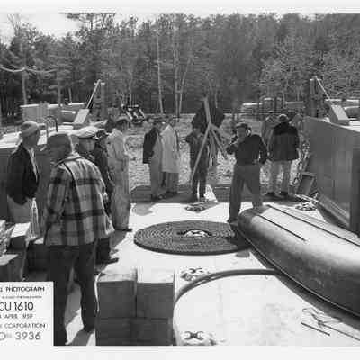 LCU-1610 at shore with people standing on deck April 24, 1959