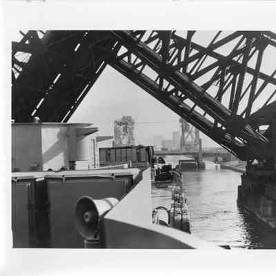 LST-1166 moving under raised bridge
