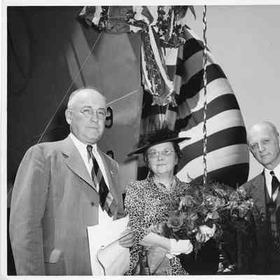 Leathem D. Smith and PC-825 ship sponsor Mrs. Zeidler in front of vessel