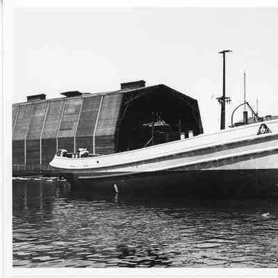 Hull of tugboat post-launch at SBSB&DD Co.