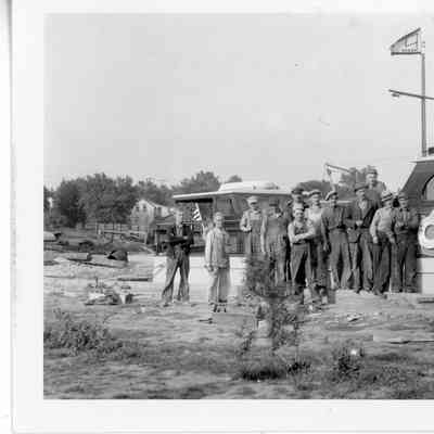 Group of workers standing in front of Cruiser Alexander Botts 1938