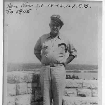 Captain Dan Leander standing by Stone Wall