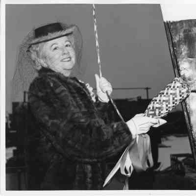Woman holding christening bottle at christening of PC-1229