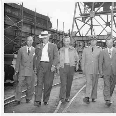L.D. Smith and C. Ray Christianson with unidentified men