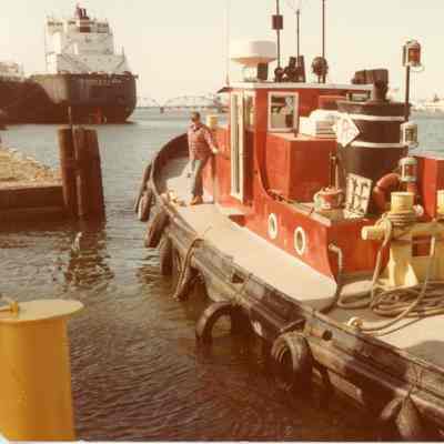 Tug Arrow dockside with vessel Charles E. Wilson in background