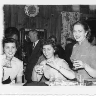 Women at bar during naval office party