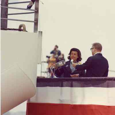 Woman about to christen Discovery