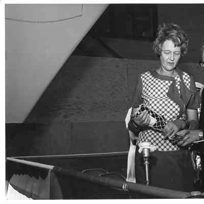Woman about to christen PG-95 USS Defiance
