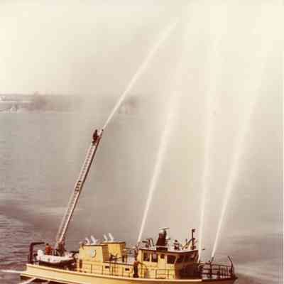 Fire boat Curtis Randolph with hoses shooting water 1979