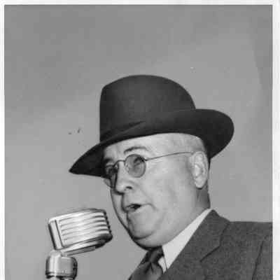 Leathem D. Smith at microphone