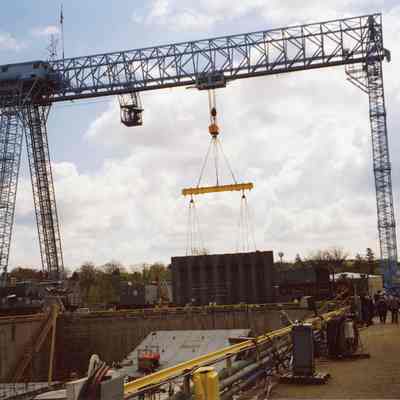 Gantry crane raising a panel to place in the graving dock for oil barge Energy 2005