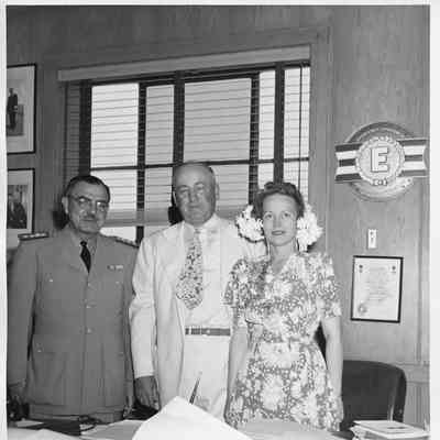 L.D. Smith and Alva Smith alongside officer in office