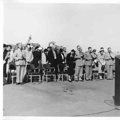 People standing on deck of LST-1166