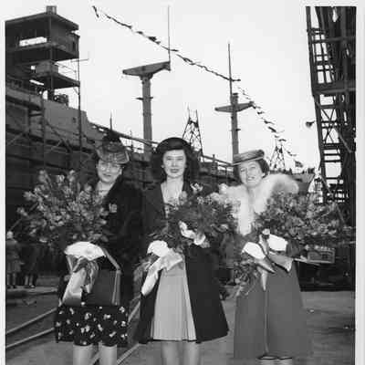 Mrs. F. A. Floden, Miss Nancy Jean McMillan, and Mrs. Paul H. Townsend at christening of YW-126 Tulare