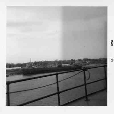 Docked vessel with star on smokestack March 1964