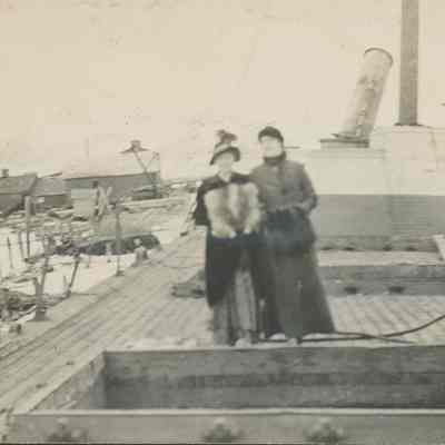two women on deck of a freighter