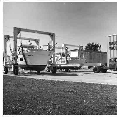 Truck with lifts hauling boats at Baudhuin Yacht Harbor