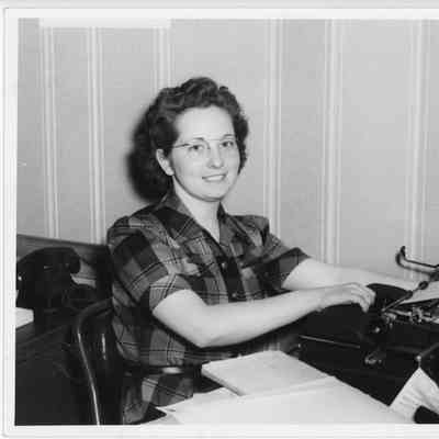 Cleo Drury working at typewriter