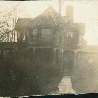 house with dog on front walk